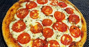 Pizza con tomate